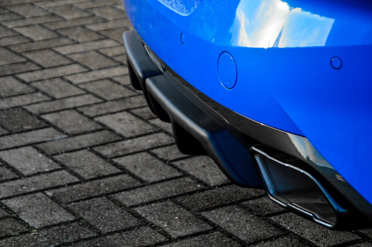 Heckansatz Aufsätze für BMW Z4 G29 von Ingo Noak Tuning, sportliches Fahrzeugdetail, aus schwarzem Kunststoff gefertigt.